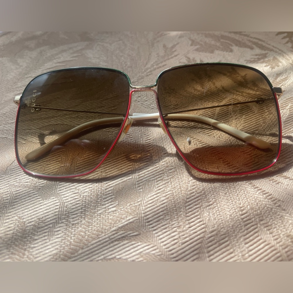 Gucci Red and Gold Sunglasses with gold accent.